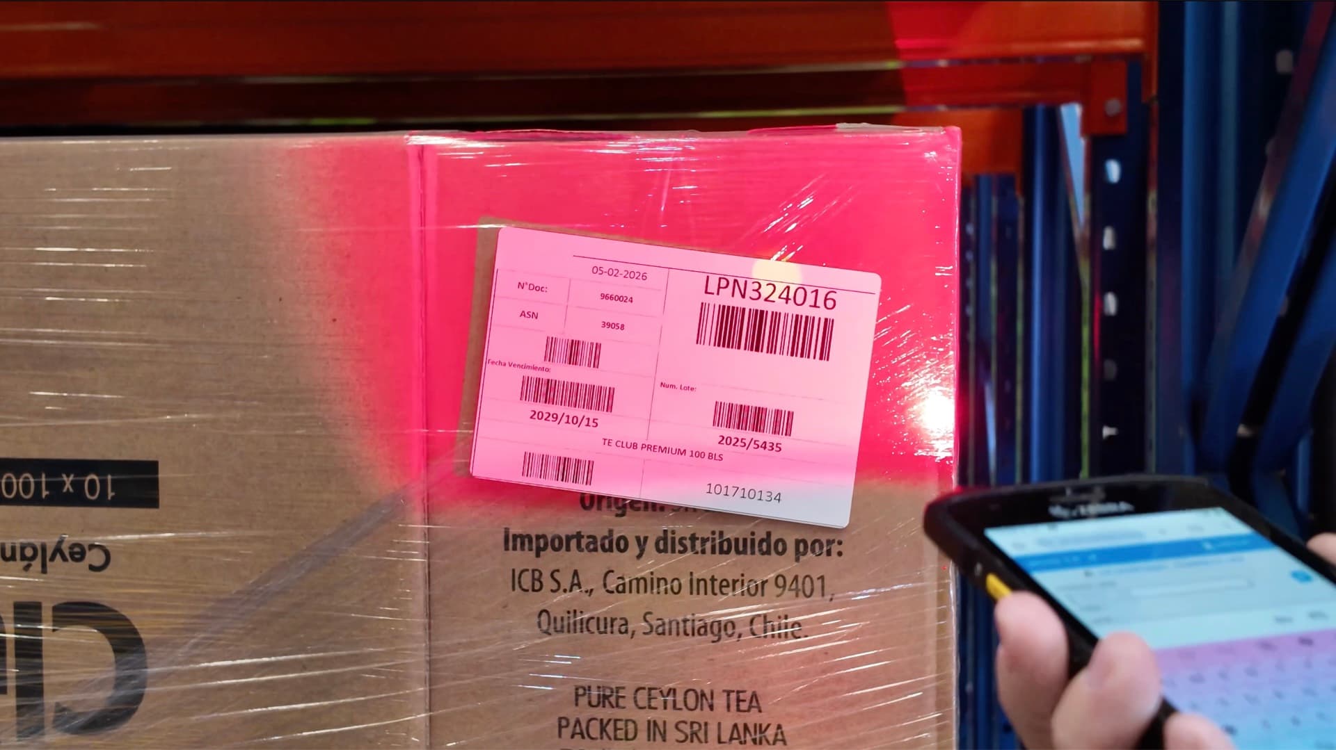 Operator scanning an LPN with radio frequency for lot-level traceability at Trailer Logistics